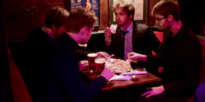 the band eats during a break at the trefor.net xmas party at the PhoenixArtistClub inSoHo